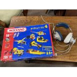 A box of Meccano Evolution 4 and vintage headphone set.