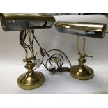 Two brass desk lamps.