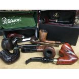 A collection of 7 pipes including Comoys and The O