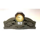 An Art Deco spelter clock with lioness decoration.