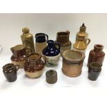 A collection of stoneware jugs and bottles includi