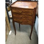 A pair of French bedside cabinets.