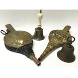 Two old brass bells, one with a China handle. Also