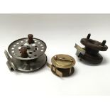 A Victorian wood and brass fishing reel, a small b