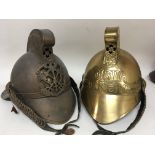 Two retrospective copyâ€™s of old brass fireman helmets (2)