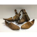 A collection of wooden shoe lasts.