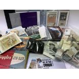 A collection of proof cased coins (10), tea cards,