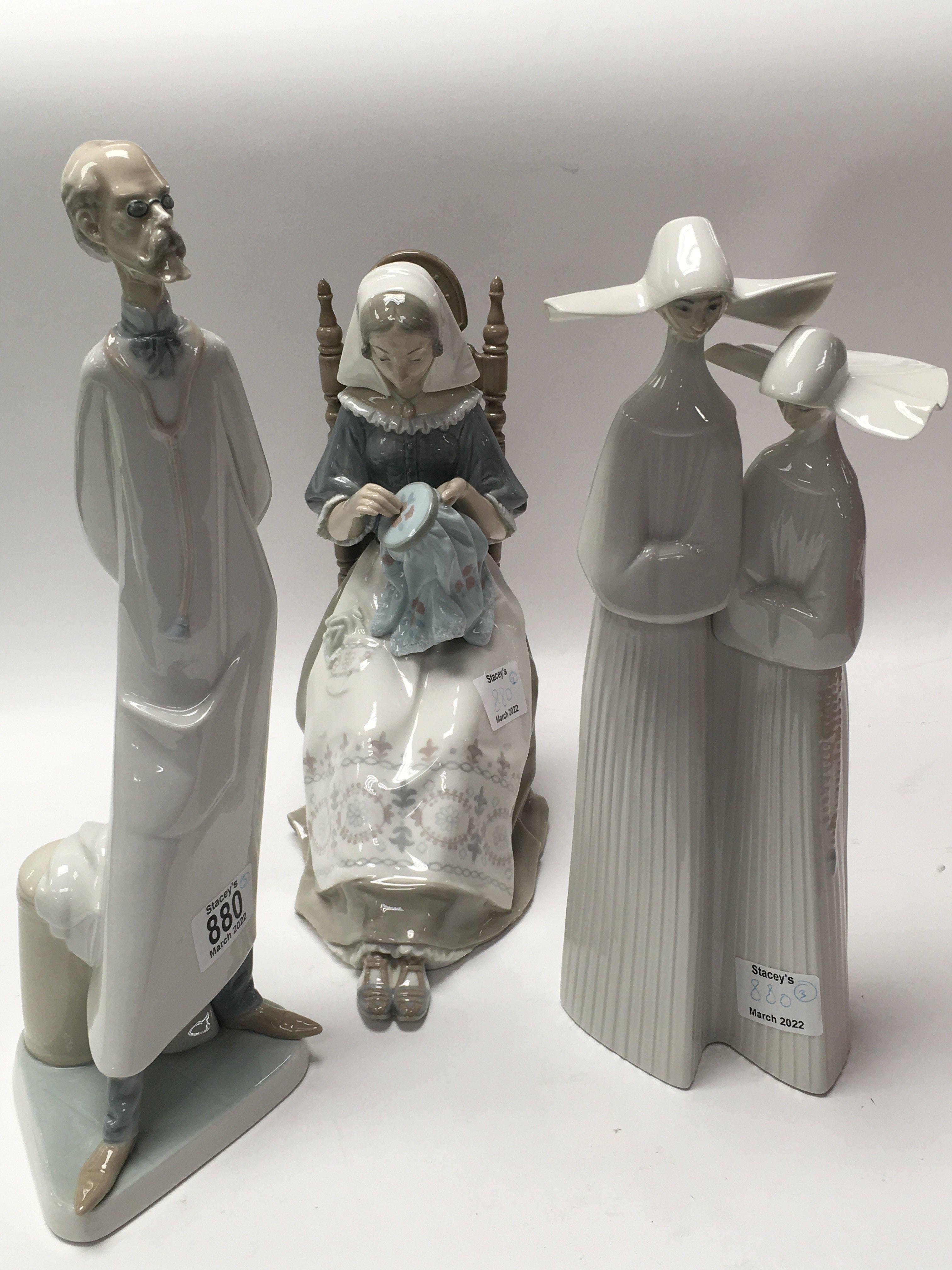 Three Lladro figures including wise doctor, seated