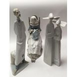 Three Lladro figures including wise doctor, seated