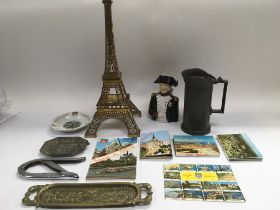 A collection of French souvenir items comprising a