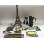 A collection of French souvenir items comprising a