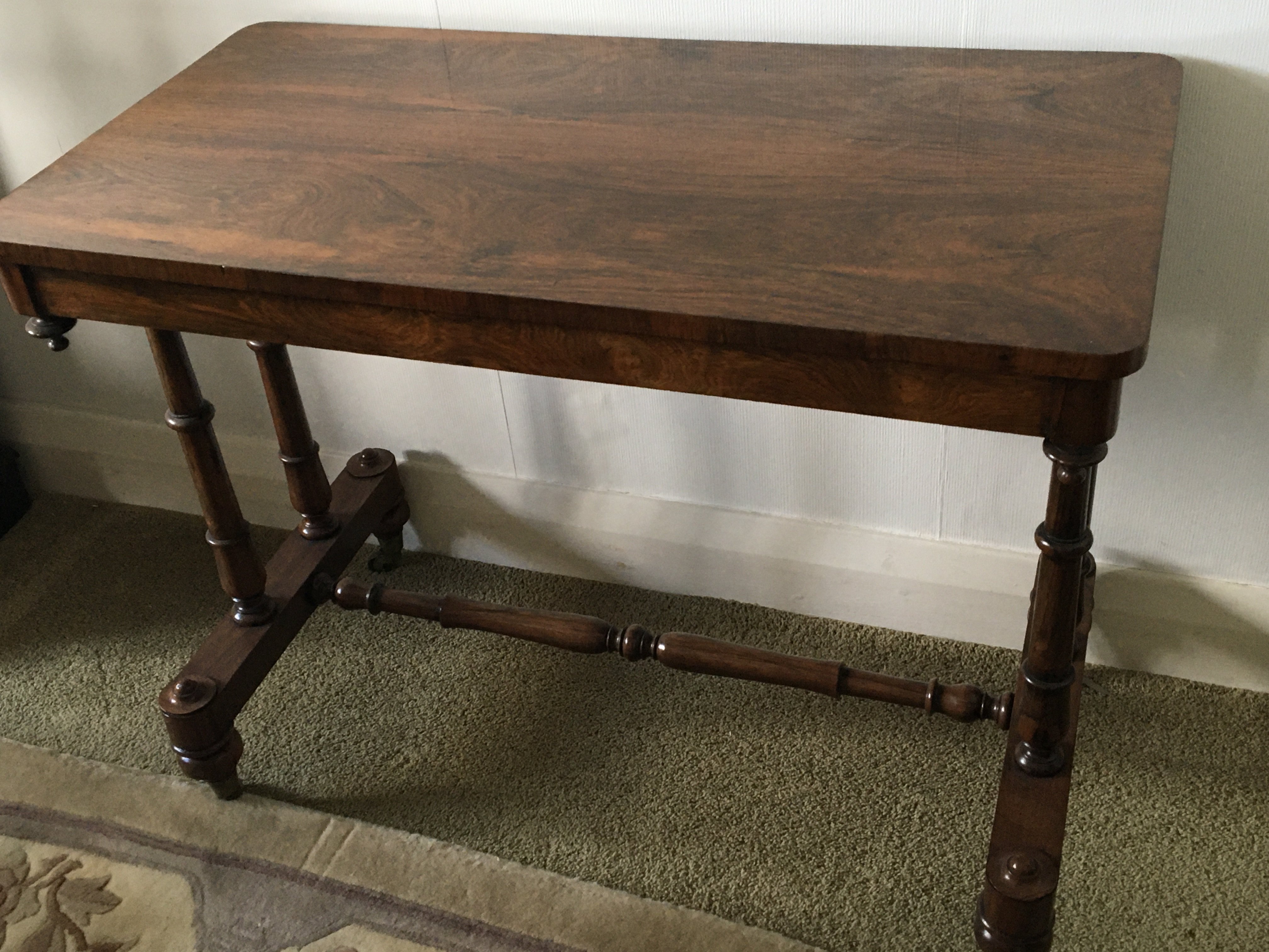 A Rosewood Victorian stretcher base table the rect