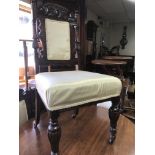 A set of four Edwardian dining chairs the carved t