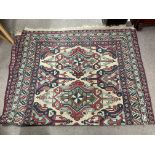 A Turkish hand knotted rug with geometric design.