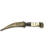 A North African knife with a decorated handle and
