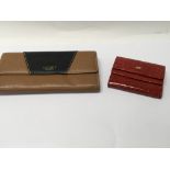 A Braun Buffel red wallet and Osprey London purse.