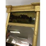 A Regency gilt wood wall mirror inset with a Briti