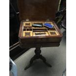 A Continental walnut work box with a well fitted i