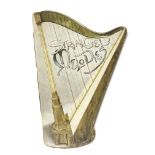 A small book in the shape of a Harp titled Stringe