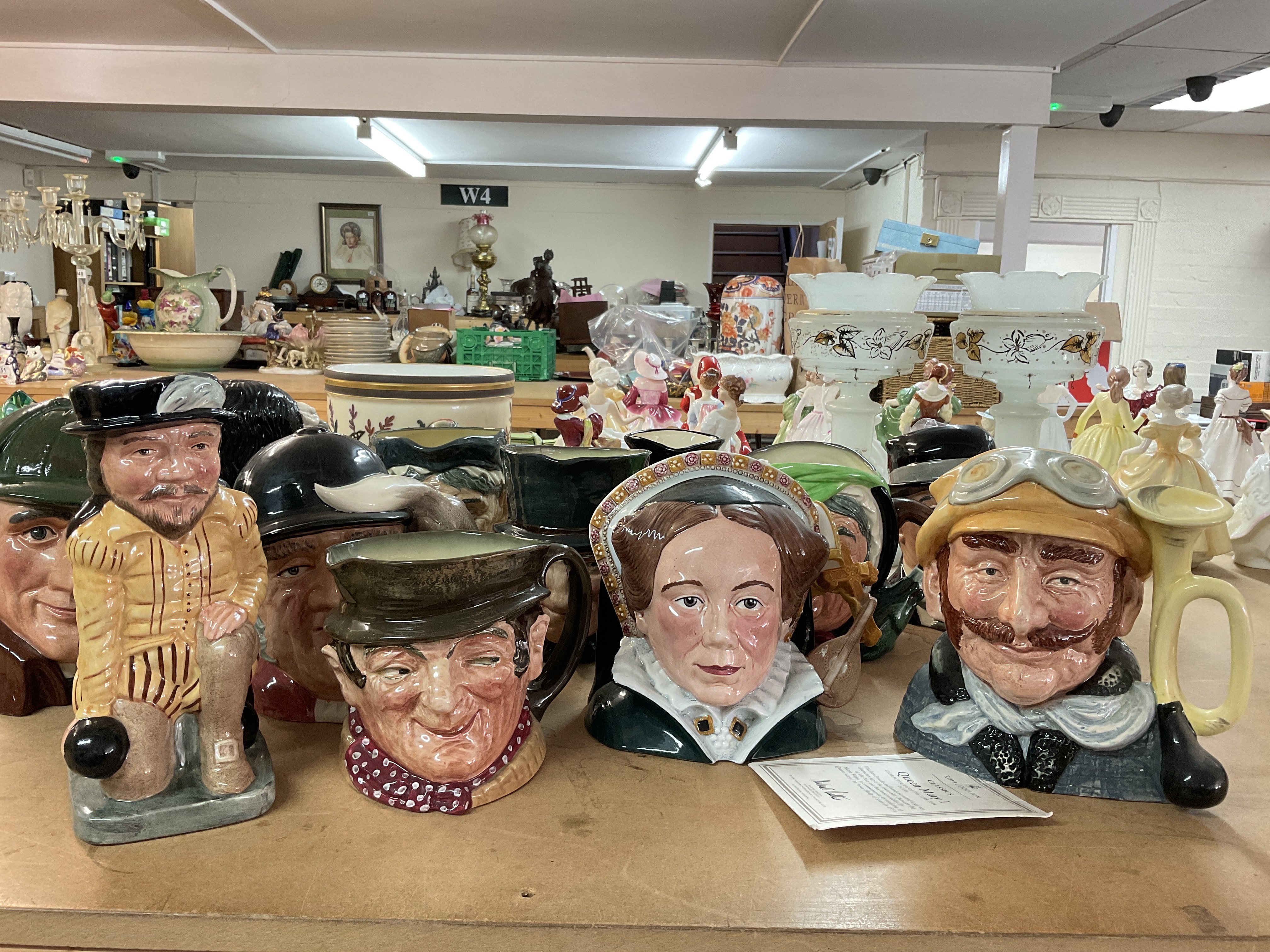 A large collection of Doulton character jugs inclu