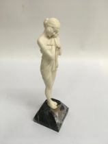 A Art Deco Ivory figure in the form of a maiden.