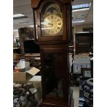 A reproduction long case clock.