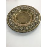 A Victorian brass embossed dish, possibly a church