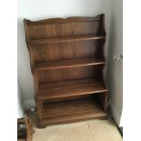 An Ercol 3 shelve bookcase with cupboard. Sizes in