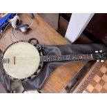 A vintage banjo with case.