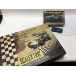 A boxed vintage Scalextric racing kit and Revell m
