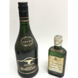 A small vintage bottle of Gordon's Dry Gin togethe