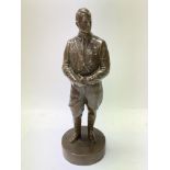 A bronze figure of Adolf Hitler.