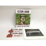 Two Elton John tour programs and tickets.