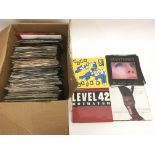 A box of. 7inch singles comprising mainly 1980s ar
