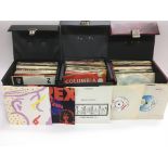 Three record cases of 7inch singles by various art