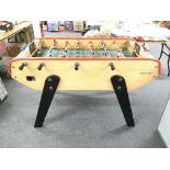 A Bonzini football table. Approximate height 96cm