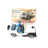 T.N battery operated police patrol jeep in box (wo