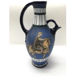 An Austrian jug depicting a man riding a horse, wi