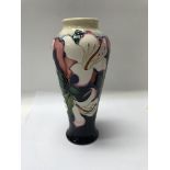 A moorcroft vase decorated with the valley gardens