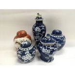 A collection of mainly Chinese blue and white jars and covers.