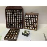 A mixed collection of thimbles with display cases.