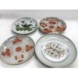 Four Chinese plates of varying sizes and design as