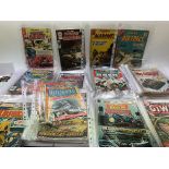 A collection of vintage comics to include DC, Charlton and Atlas comics.