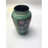 A small early moorcroft vase decorated with flower