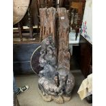 A large carved wooden free standing sculpture of elephants. Measuring approximately 140cm in