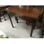 A George III mahogany card table the twin flap top