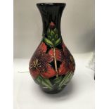 A Moorcroft vase decorated in London calling 22 cm