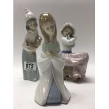 Lladro figures including girl holding chicken, sea