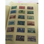 A Stan album containing American stamps and British Colonial Stamps.