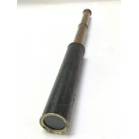 A Victorian brass and leather telescope.